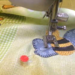 Hot off the needle - Winnie the Pooh quilt machine applique
