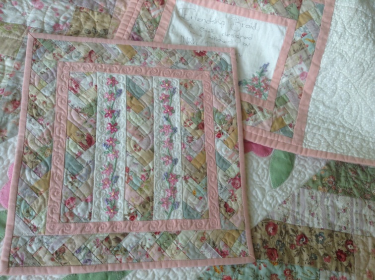 Miniature friendship braid quilt with hand embroidery